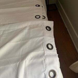 Pair of white curtains